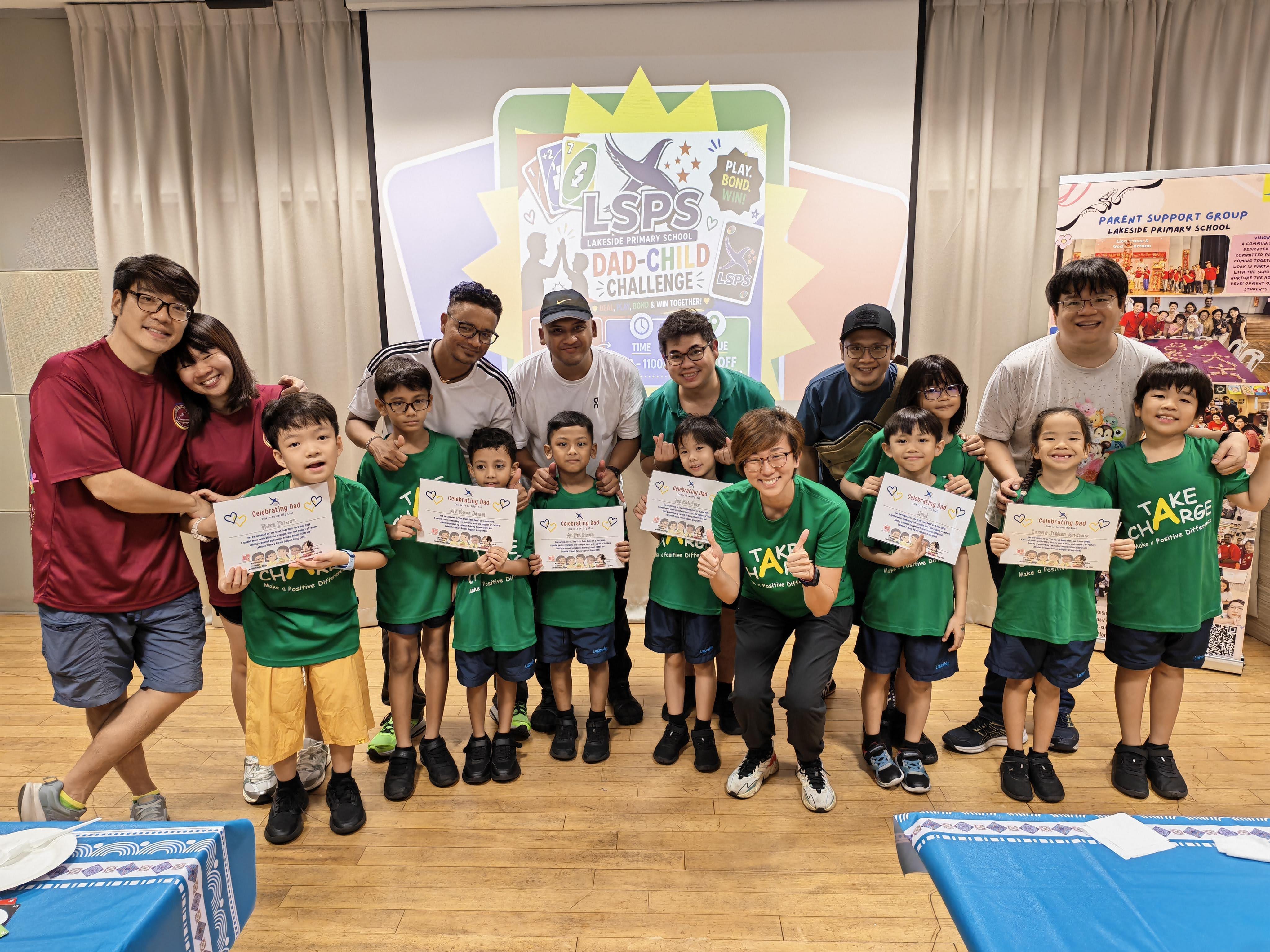 Fathers and their children take group photos together as a team at the end of the event